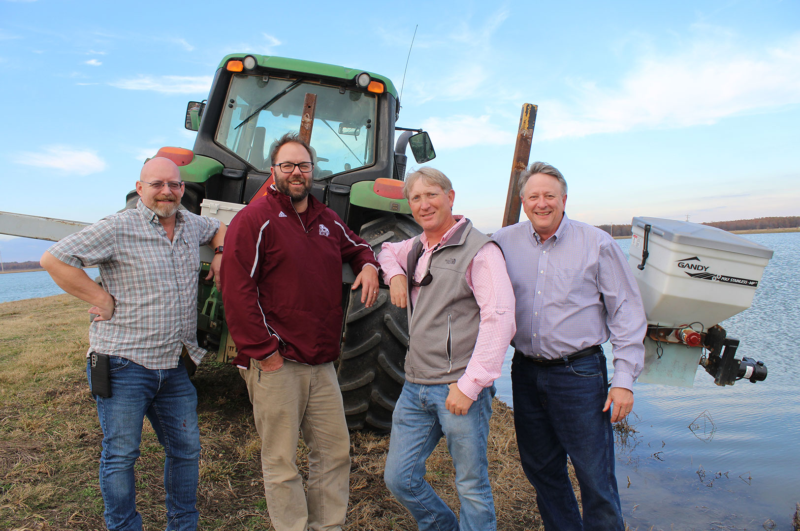 Drs. Chuck Mischke, Matt Griffin, Wes Lowe, and David Wise pose with the delivery system to administer chemicals to rid ponds of snails. (Photo by Kenner Patton)