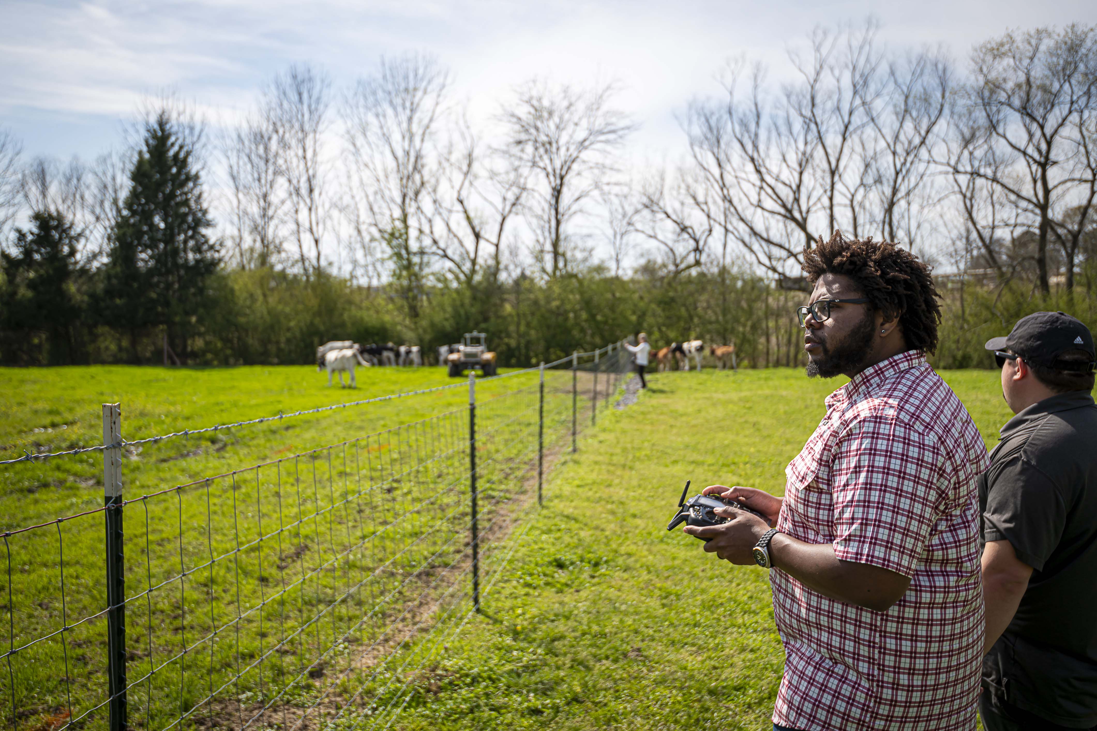 Dr. Marcus McGee navigates the Clearpath Robotics Warthog Unmanned Ground Vehicle to herd dairy cattle. (Photo by David Ammon) 