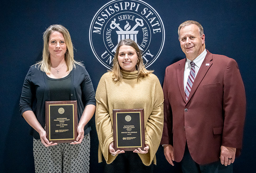Staff winners with plaques