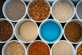 A few of the ingredients in poultry feed. MAFES scientists are exploring the combination of phytase enzymes in poultry feed.