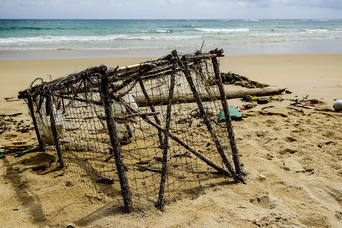 A derelict trap washes ashore. (Stock photo)