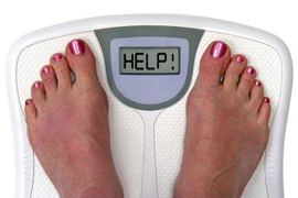 woman standing on scale with words help in display